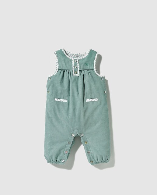 green dungarees baby