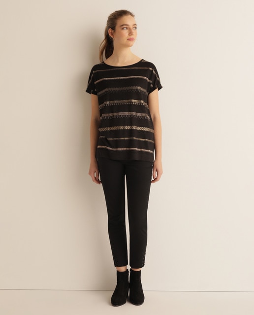 Calças de sarja de mulher com crochet