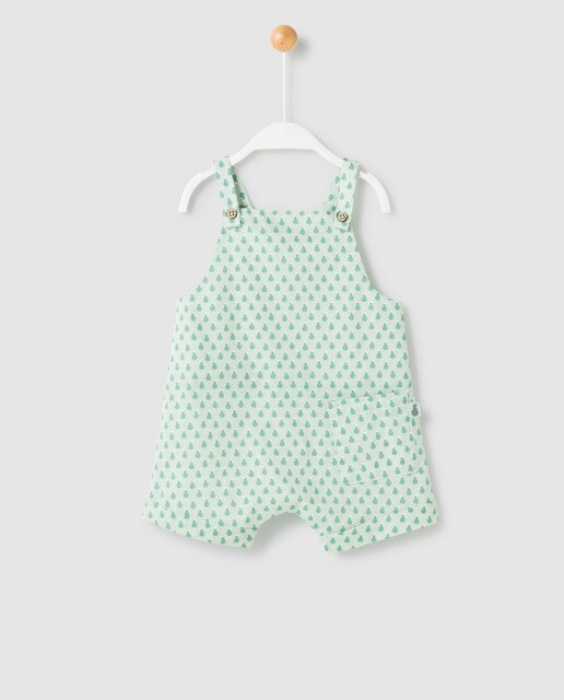 green dungarees baby