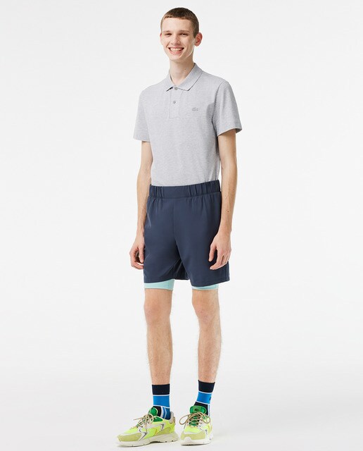 Lacoste men's two-tone athletic shorts with built-in legwarmers