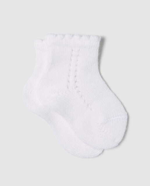 Calcetín calado de bebé Condor en blanco