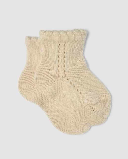 Calcetín calado de bebé Condor en beige