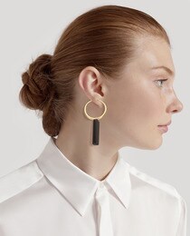 Brincos El Corte Inglés dourados e pretos