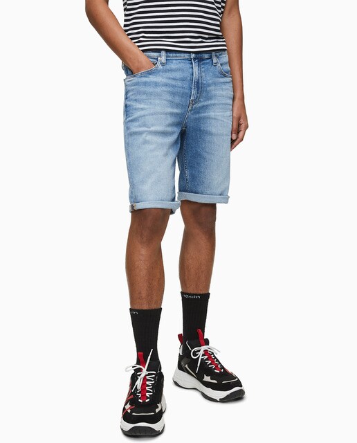 Bermudas de ganga azuis de homem