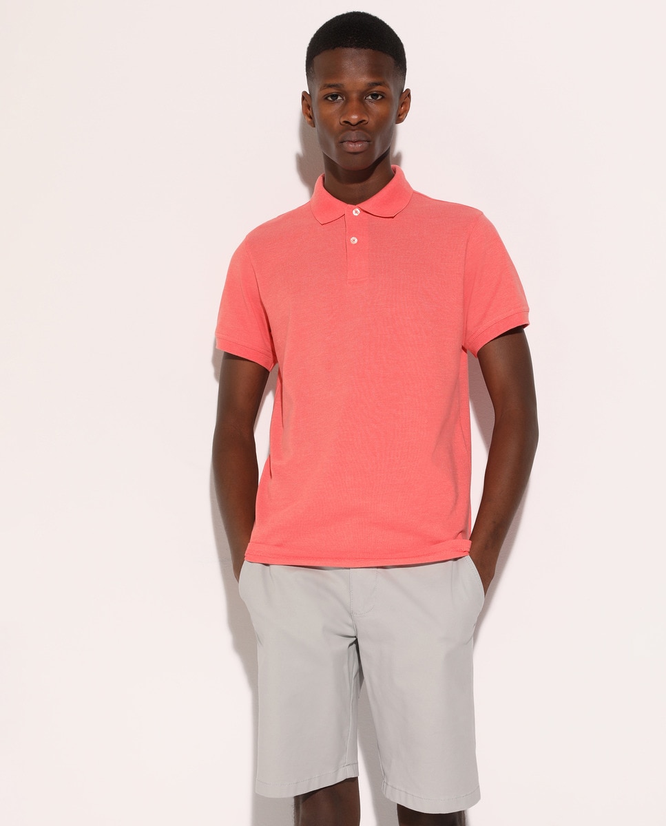 coral color polo shirt