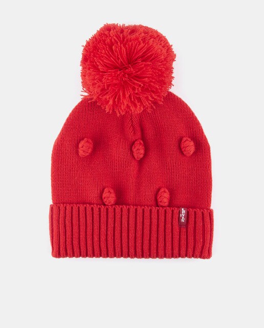 Red knit hat with pompom and tassels 