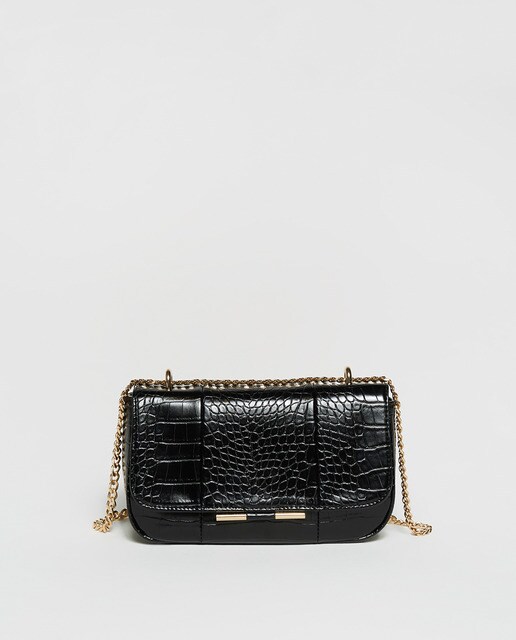 Shiny crossbody bag with chain · Women's fashion · El Corte Inglés