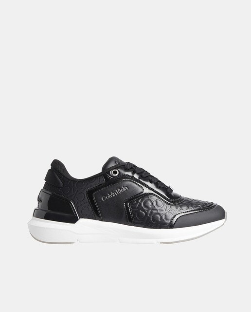 Chaussures femme style running basses en cuir avec logo all-over et semelle épaisse