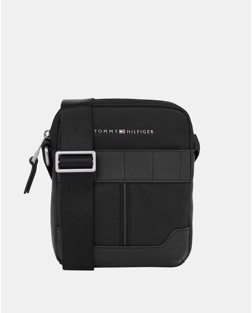 Small black flat crossbody bag with metallic logo on front