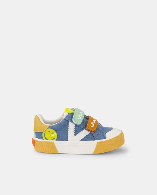 Baby's blue low-top canvas trainers with logo and double adhesive strap