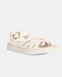 Women's flat white sandals with criss-cross straps and buckle fastening