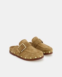 Women's brown flat clogs with studs and buckled strap