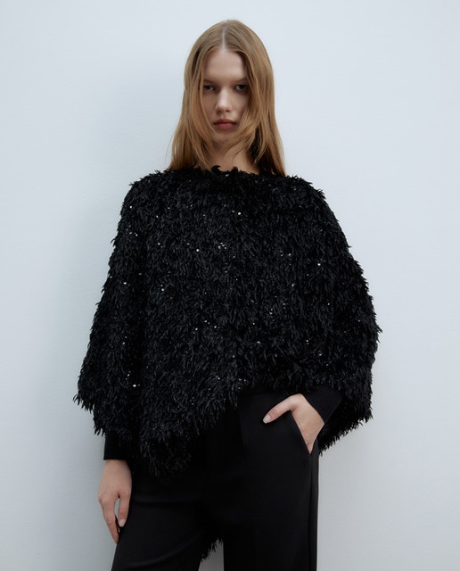 Poncho pluma lentejuelas