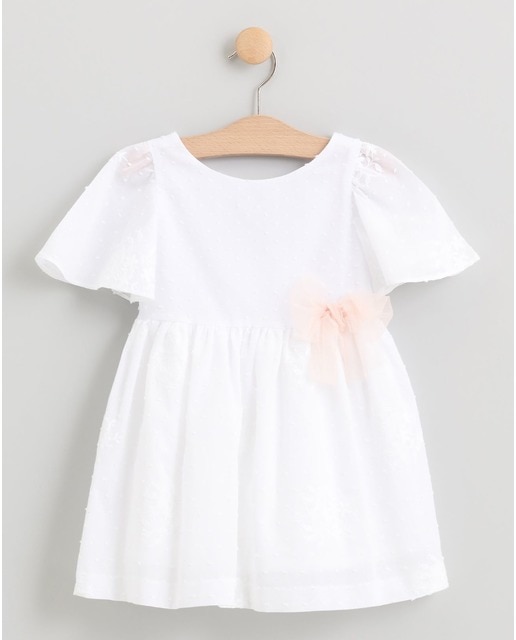 Vestido de plumeti y falda bordada