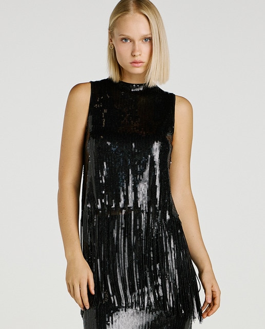 Top de mujer con lentejuelas y flecos