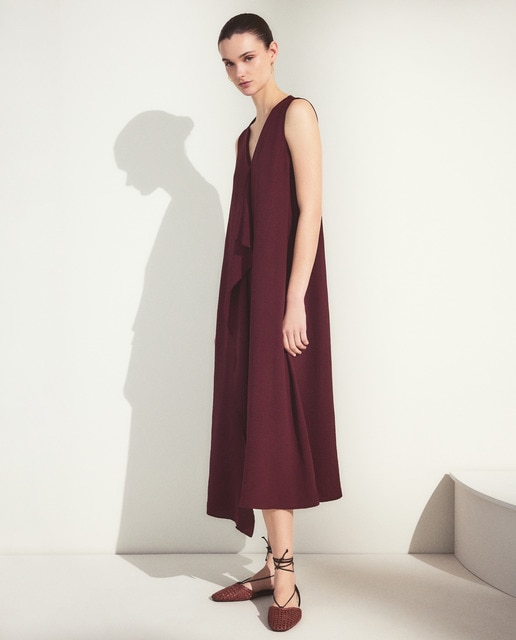 Woman El Corte Inglés - Vestido liso sin mangas con volante central.